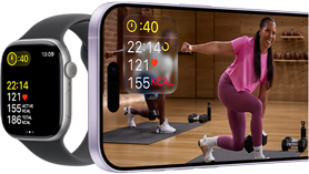 Apple Watch next to iPhone with Apple Fitness+ class on screen