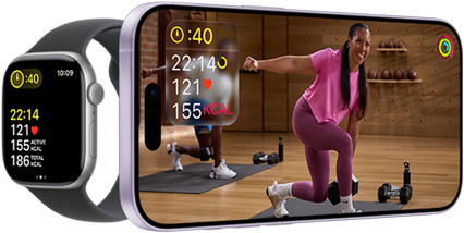 Apple Watch next to iPhone with Apple Fitness+ class on screen
