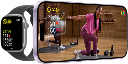 Apple Watch next to iPhone with Apple Fitness+ class on screen