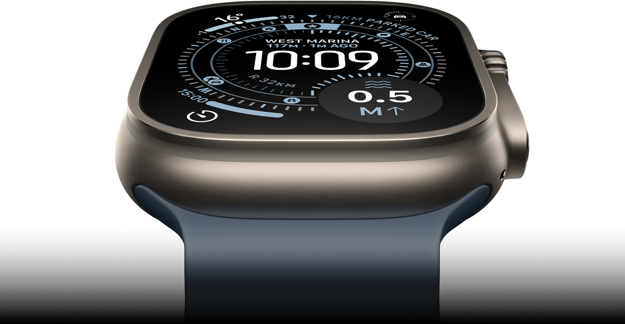 Apple Watch Ultra 3 tilted forward, natural titanium case, compass on Orienteering watch face, anchor blue Ocean Band