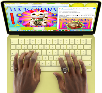 MacBook Neo, citrus color, hands on keyboard, user is composing an email invitation to the opening of an art exhibit, website for the event open alongside